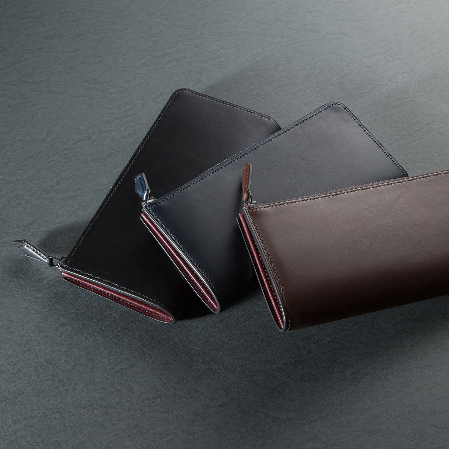 ブリランテ L字ジップ長財布：左から Black、Navy Dark、Brown